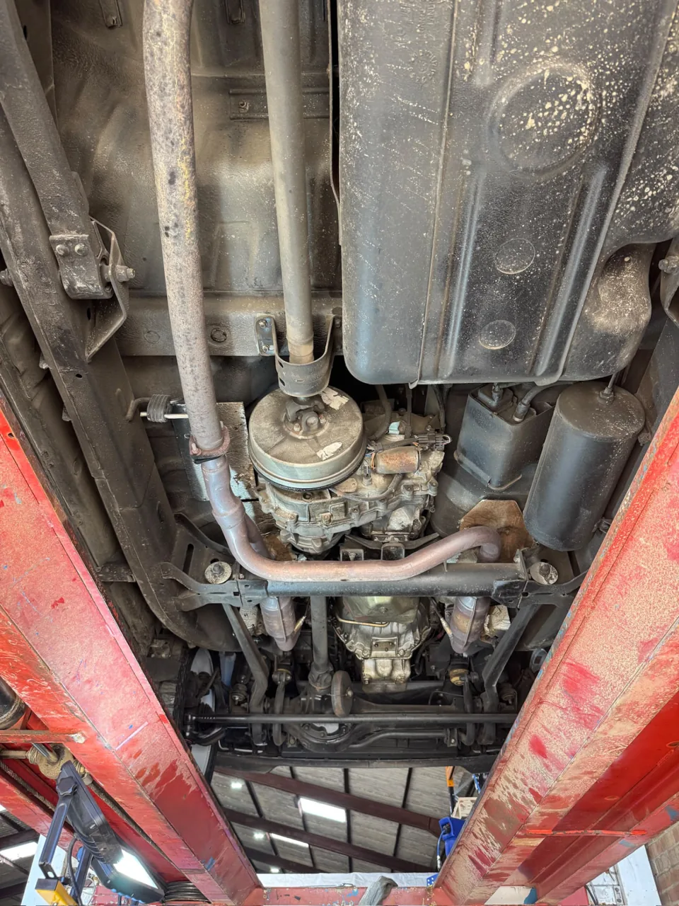 Vehicle drivetrain, exhaust and floor pan photographed from underneath